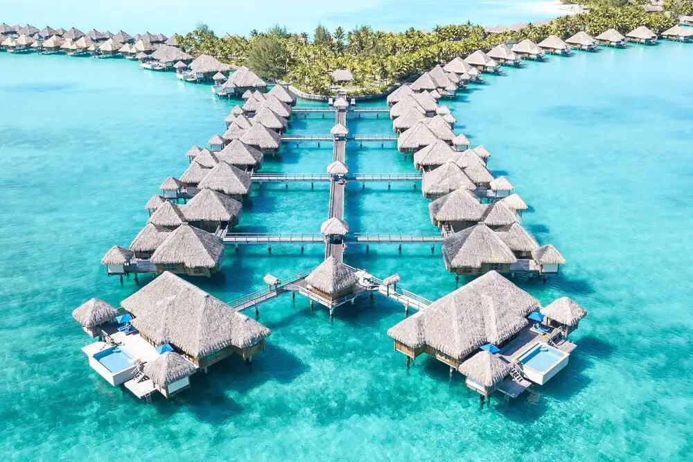 Overwater bungalows in a row at St. Regis Bora Bora