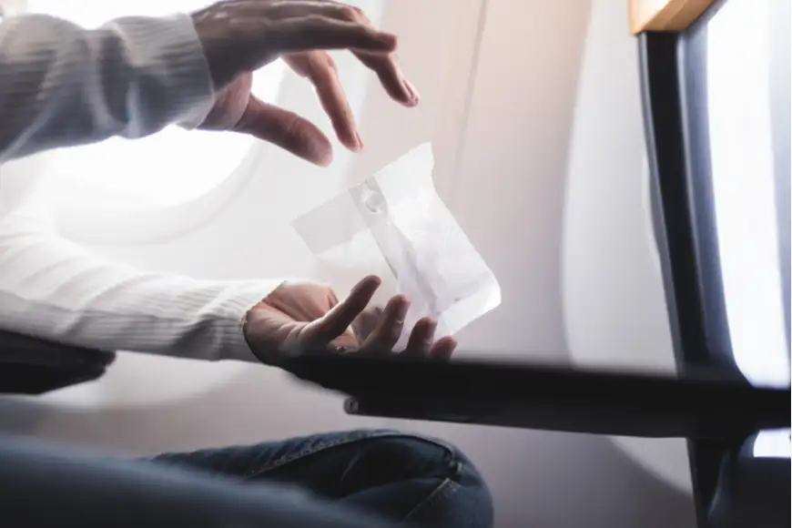 eating peanuts on plane.