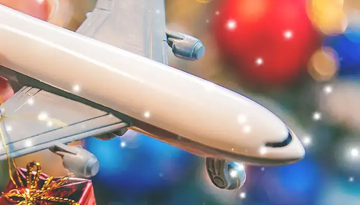 Person holding toy airplane