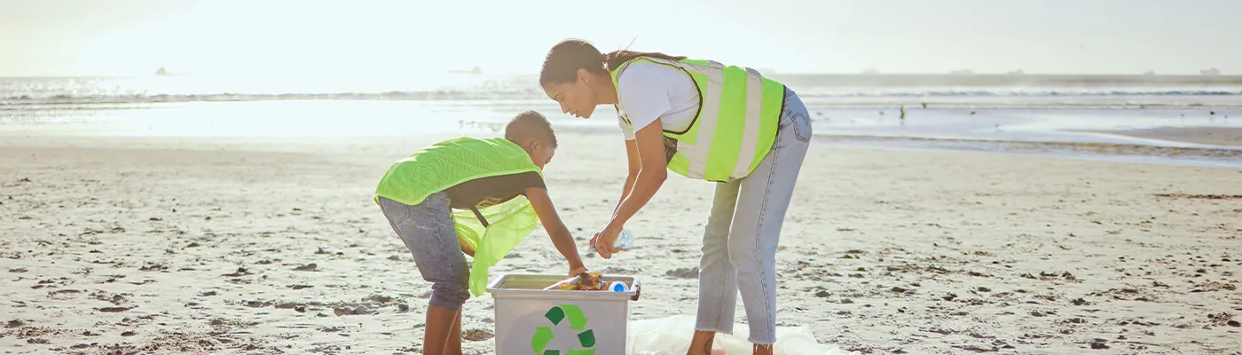 People recycling garbage on the beach
